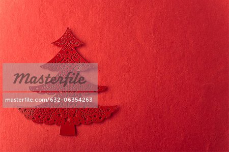 Christmas tree shape on red background