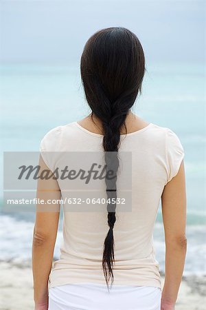 Woman with long braid, rear view