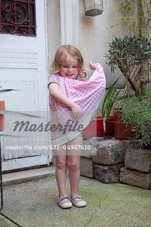 Little girl wearing a dress playing in a, Stock Video