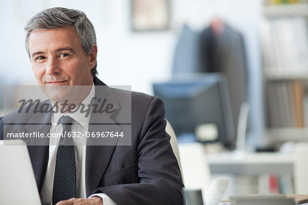 Mature businessman in office, portrait