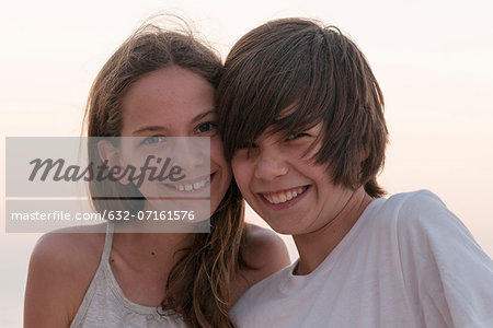 Brother and sister together outdoors, portrait
