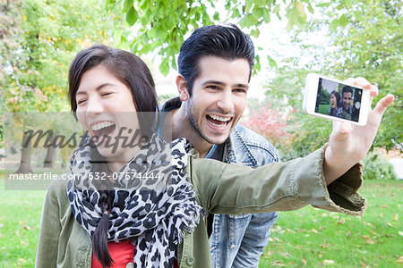 Couple taking self portrait with smartphone