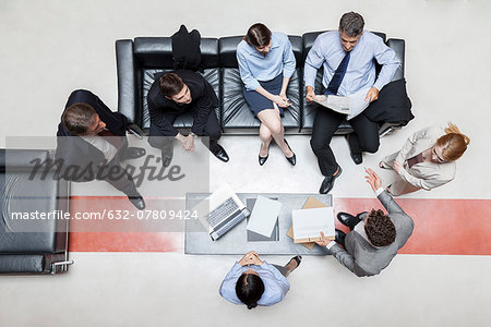 Executives in meeting, overhead view