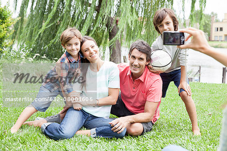 Using digital camera to photograph family with two children, personal perspective