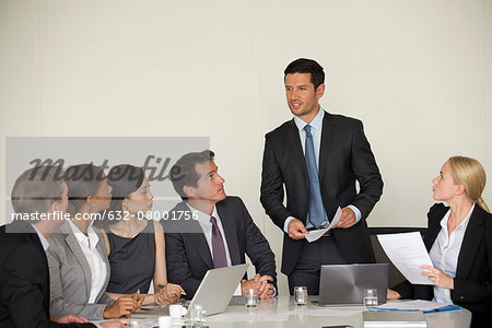 Executive giving presentation in meeting