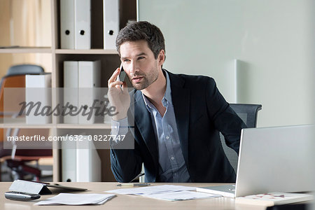 Businessman making important phone call Businessman making important phone call