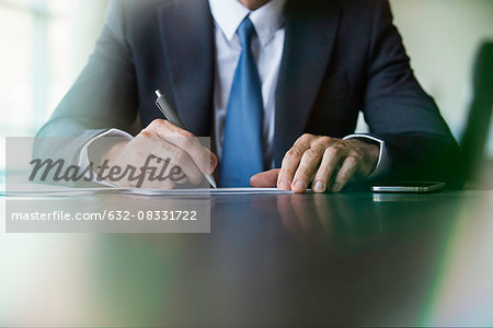 Businessman doing paperwork Businessman doing paperwork