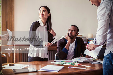 Interior designers and clients looking at color swatches