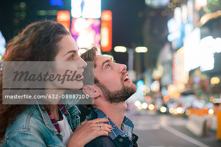 Young couple sightseeing in Times Square, New York City, New York, USA