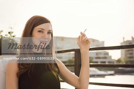 Woman smoking cigarette Woman smoking cigarette