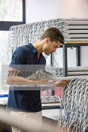 Man inspecting products in factory