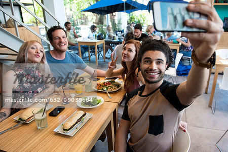 Man taking selfie with friends