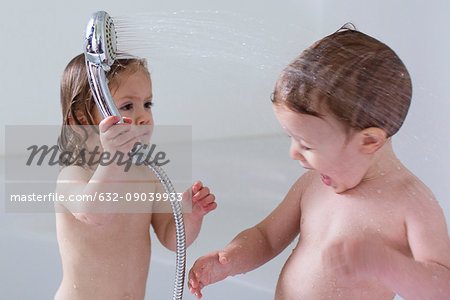 Children playing in bathtub