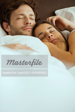 Couple In Love Sleeping In Bed Stock Photo, Picture and Royalty