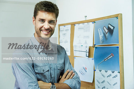 Portrait of engineer standing in office