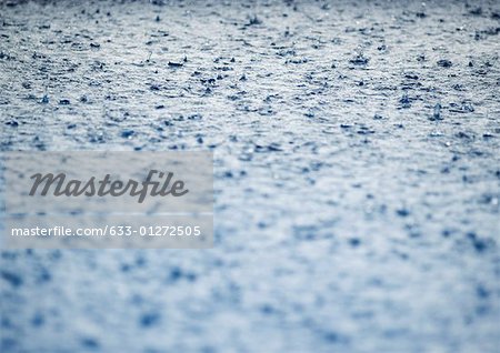 Rain falling on surface of water