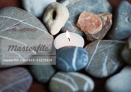 Candle and stones