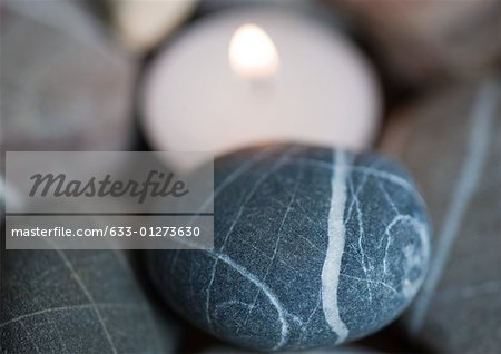 Candle and stones