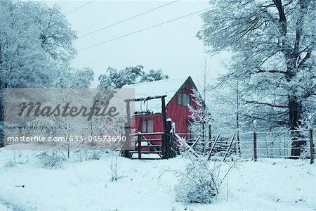 Snowy landscape with chalet