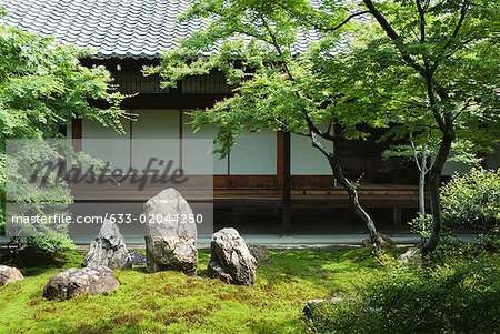 Japanese rock garden, traditional building in background