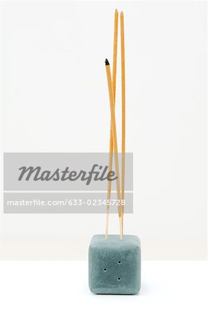 Incense sticking up out of incense holder