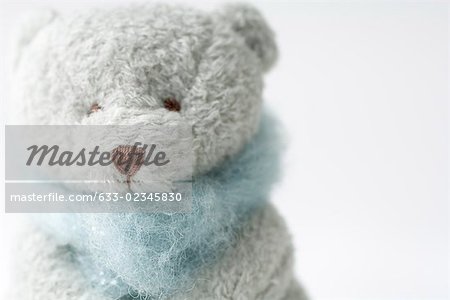 Teddy bear wearing scarf, close-up