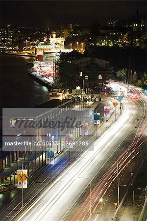 Sweden, Sodermanland, Stockholm, street illuminated by light trails at night
