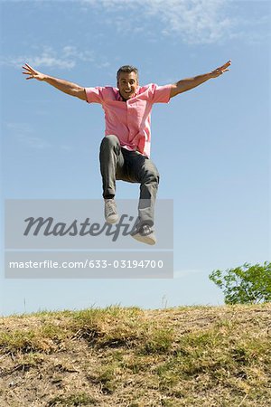 very happy man jumping