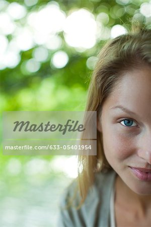 Woman smiling at camera, cropped portrait