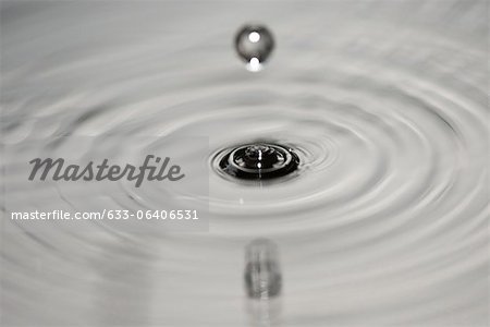 Drop hitting surface of water