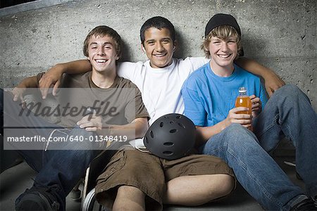 Portrait of three teenage boys smiling