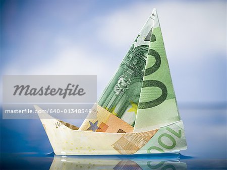 Paper sailboat made of Euro banknotes