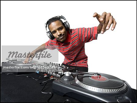 DJ with headphones spinning records DJ with headphones spinning records