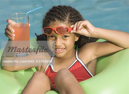 Portrait of a girl on float in a pool
