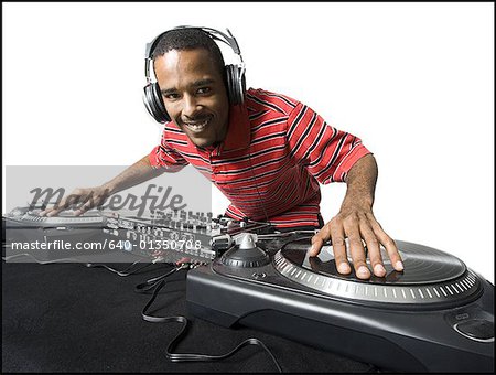 DJ with headphones spinning records DJ with headphones spinning records
