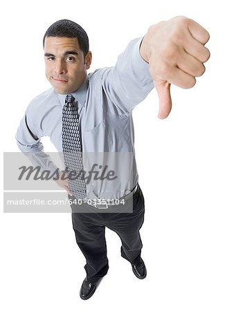 Disappointed Man With Thumbs Down Stock Photo, Picture and Royalty