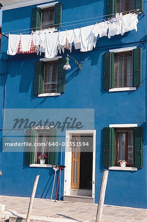 Low angle view of a clothesline outside a building