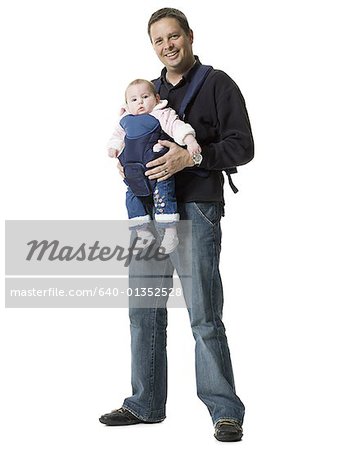 Portrait of a mature man carrying his daughter