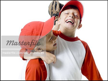 Close-up of two baseball players smiling