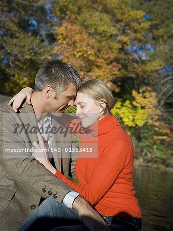 Couple embracing while sitting on a boat