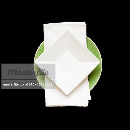 Square plate on napkin with round plate underneath