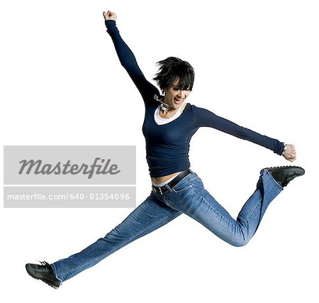 Mid adult woman jumping