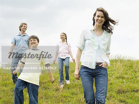 Family walking in a field