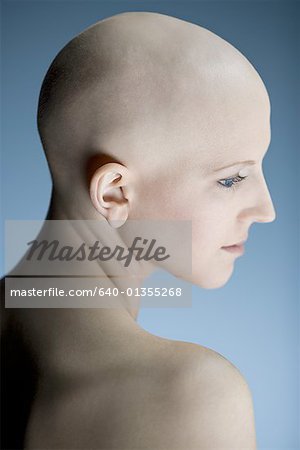 Profile of a bald young woman thinking