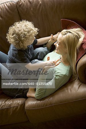 High angle view of a mother playing with her son