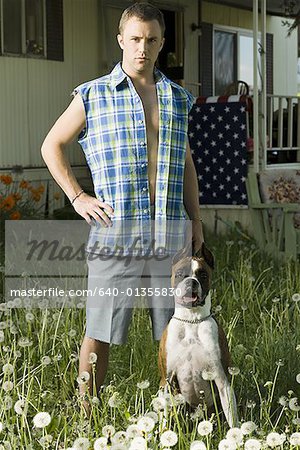 Man in trailer park with dog