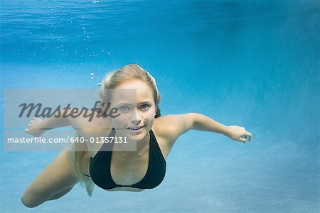 Portrait of a teenage girl swimming underwater, Stock Photo, Picture And  Royalty Free Image. Pic. WR0906977