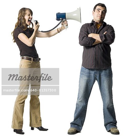 Woman yelling at man through megaphone