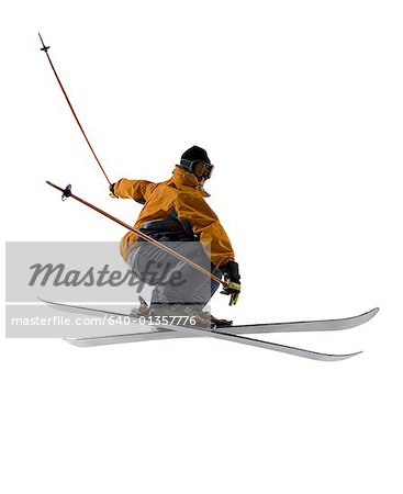 Low angle view of a young man skiing