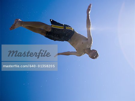 Low angle view of a man diving